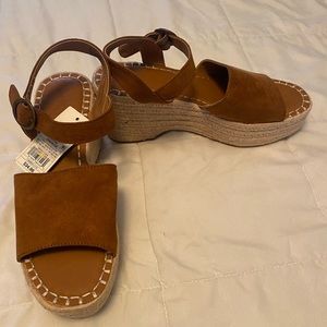 Cognac Brown Wedge Heel Sandal. Heel Height is 3.25
inch.